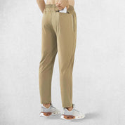 Back pose of model wearing Light Khaki GPW Men’s Lightweight Athletic Joggers with Zipper Pockets for Gym & Running