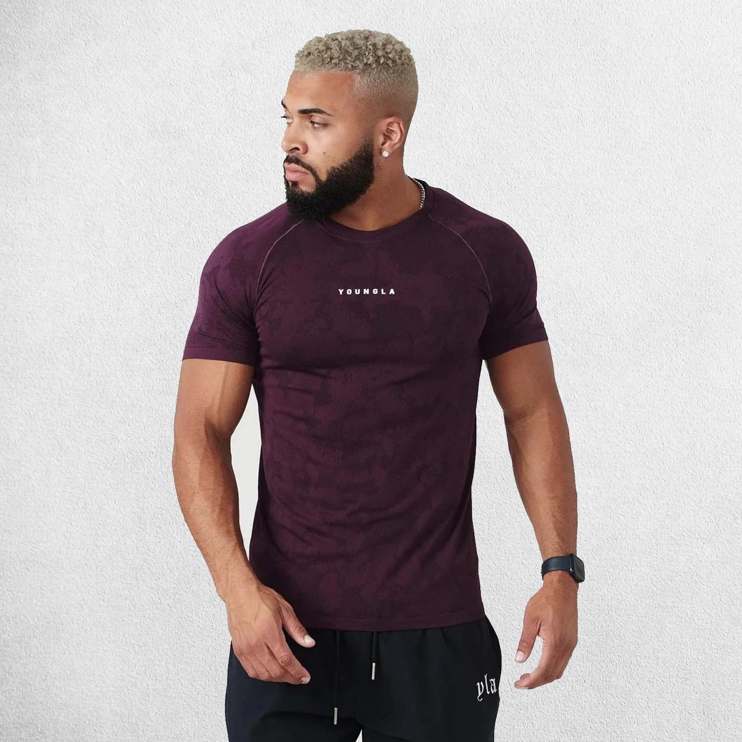 Model Wearing Light Purple Men’s Quick-Drying Gym Sports Fitness New Summer Compression T-Shirt in a studio backround