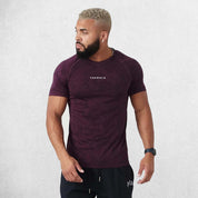 Model Wearing Light Purple Men’s Quick-Drying Gym Sports Fitness New Summer Compression T-Shirt in a studio backround