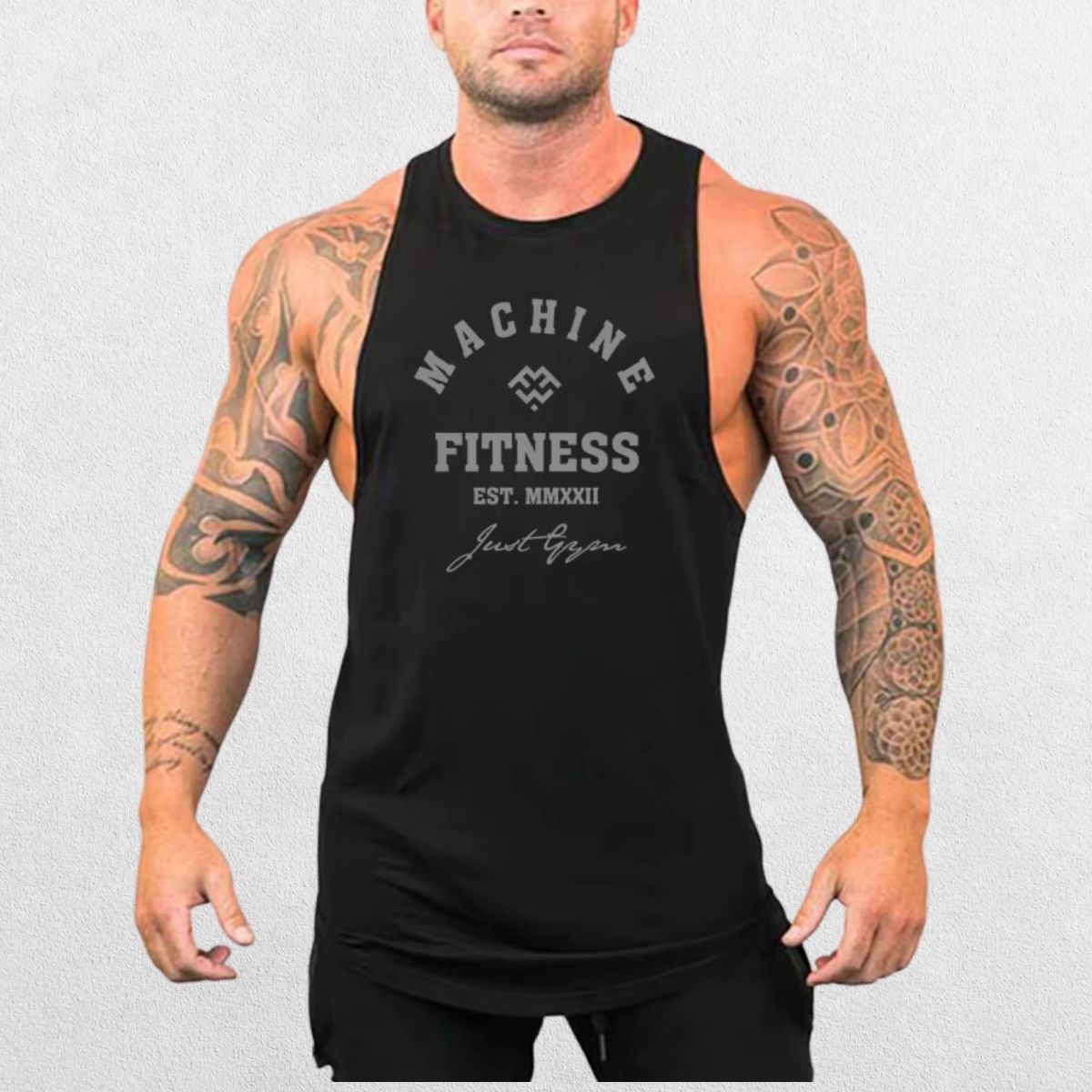 Front view of the Machine Fitness Bodybuilding Tank Top in black, featuring bold branding and a sleek, slim-fit design on a model.