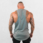 Back view of the Machine Fitness Bodybuilding Tank Top in grey, displaying the tailored fit and gym-ready look on a model.