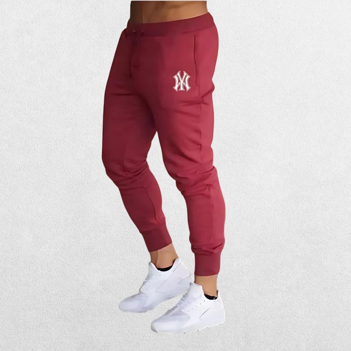 Stylish Man Pants Summer Casual Trousers in red, highlighting the bold color and ergonomic fit ideal for workouts or streetwear.
