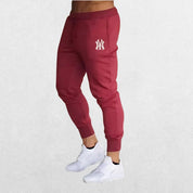 Stylish Man Pants Summer Casual Trousers in red, highlighting the bold color and ergonomic fit ideal for workouts or streetwear.