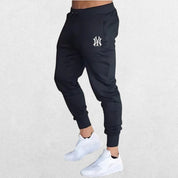 Classic Man Pants Summer Casual Trousers in black, blending performance and fashion for gym, sports, and everyday wear.