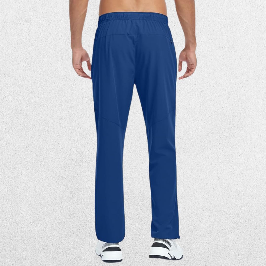 Men’s lightweight quick-dry hiking trousers in blue, shown from the back in studio setting, highlighting fit and design.