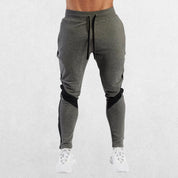 Men’s Casual Sports Jogger Sweatpants in grey color, front view showcasing slim fit and breathable fabric.