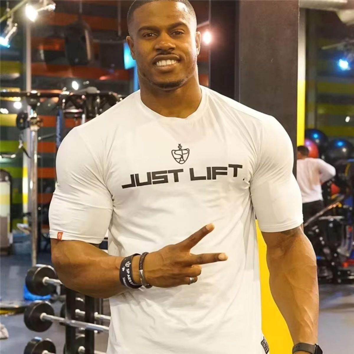 White men’s cotton sports t-shirt with a gym setting in the background.