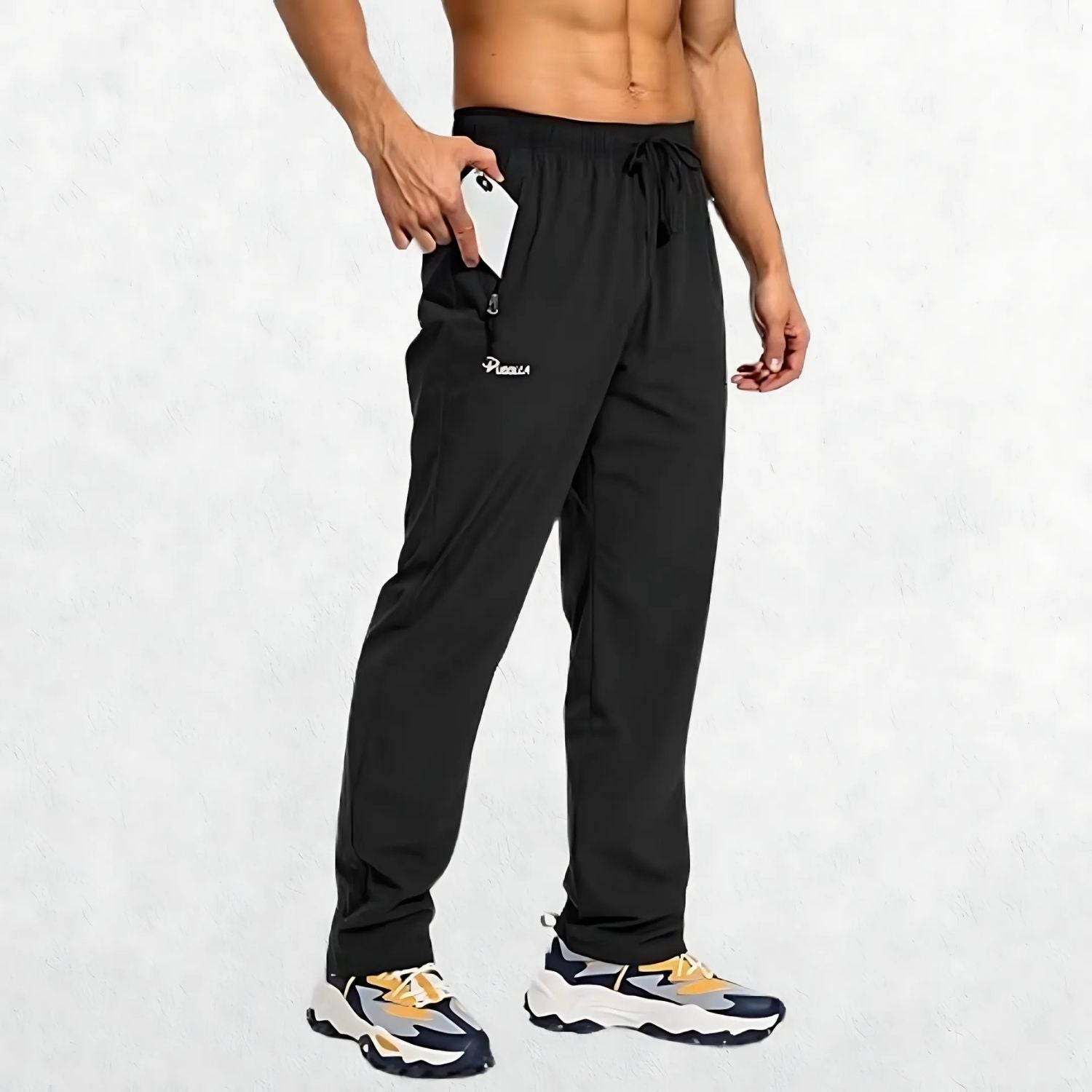 Men’s black athletic trousers with elastic waistband and zipper pockets for secure storage during workouts.