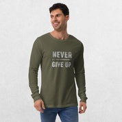 Model wearing the Military Green GPW Never Give Up Performance Long Sleeve Tee with jeans in a studio background.