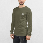 Model wearing the Military Green GPW Long Sleeve Tee paired with jeans in a Studio Background.