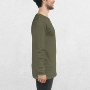 Side View of Model wearing the Military Green GPW Long Sleeve Tee paired with jeans in a Studio Background.