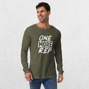 Model wearing the Military Green GPW One More Rep Unisex Motivational Long Sleeve Tee with jeans in studio background.