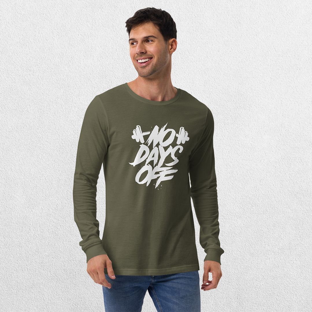 Model wearing the Military Green No Days Off Unisex Long Sleeve Tee - Versatile Athletic and Casual Wear with jeans in studio background.