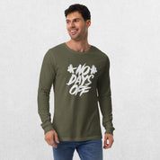 Model wearing the Military Green No Days Off Unisex Long Sleeve Tee - Versatile Athletic and Casual Wear with jeans in studio background.