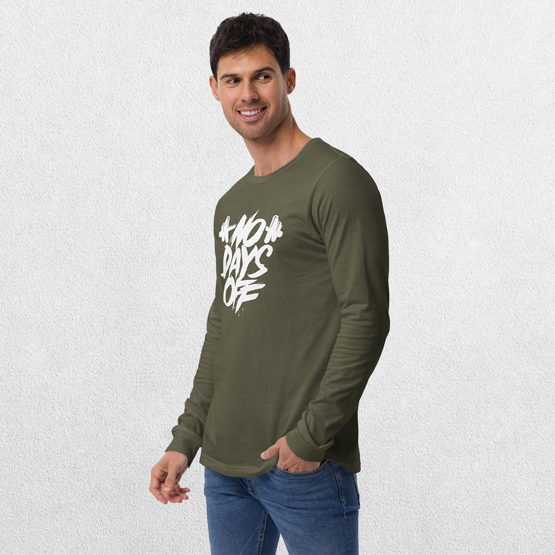 Model wearing the Military Green No Days Off Unisex Long Sleeve Tee - Versatile Athletic and Casual Wear with jeans in studio background.