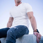 White short sleeve Muscle Fitness T-Shirt paired with casual gear.