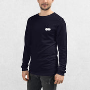 Model wearing the Black GPW Long Sleeve Tee paired with jeans in a Studio Background.