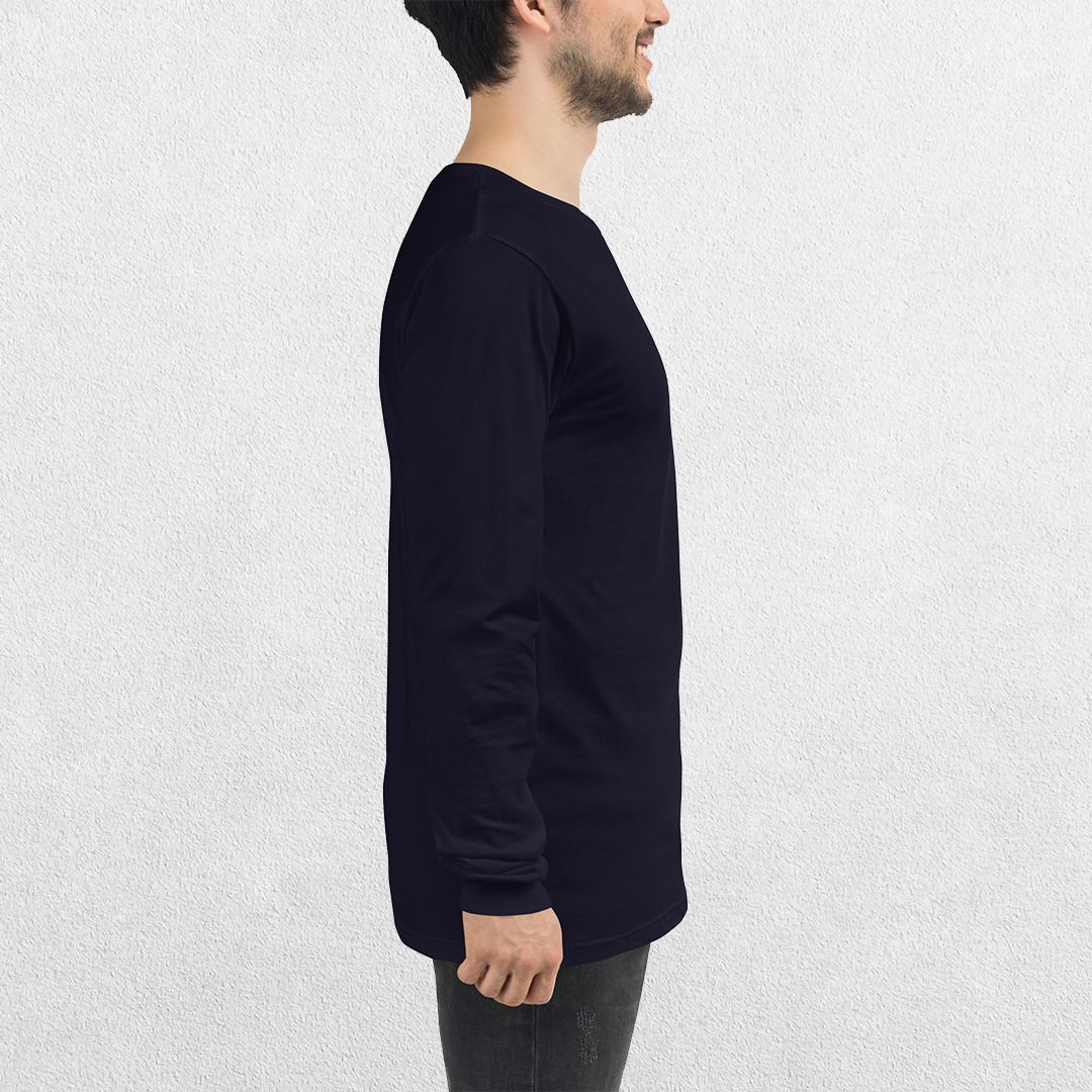 Side View of Model wearing the Navy GPW Long Sleeve Tee paired with jeans in a Studio Background.