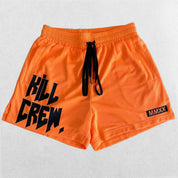 Close-up of Orange bold Kill Crew graphic print on GPW gym shorts.