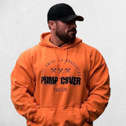 Gym Athlete wearing Orange Men's Oversized Gym Pullover Hoodie - Comfort and Cold Protection