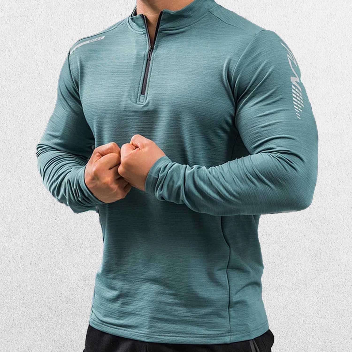 Close-up of Payne Gray Green GPW Men's Compression Shirt - Long Sleeve Rashguard for Fitness in a studio background