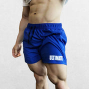 Model wearing Penn Blue GPW Men's Quick-Dry Fitness Shorts - Loose Beach Workout Bottoms