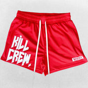 Close-up of Red GPW gym shorts with adjustable waist band in a studio background