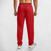 Rear View of Model Wearing Red GPW Men’s Open-Bottom Workout Trousers with Zip Pockets and Lightweight Mesh