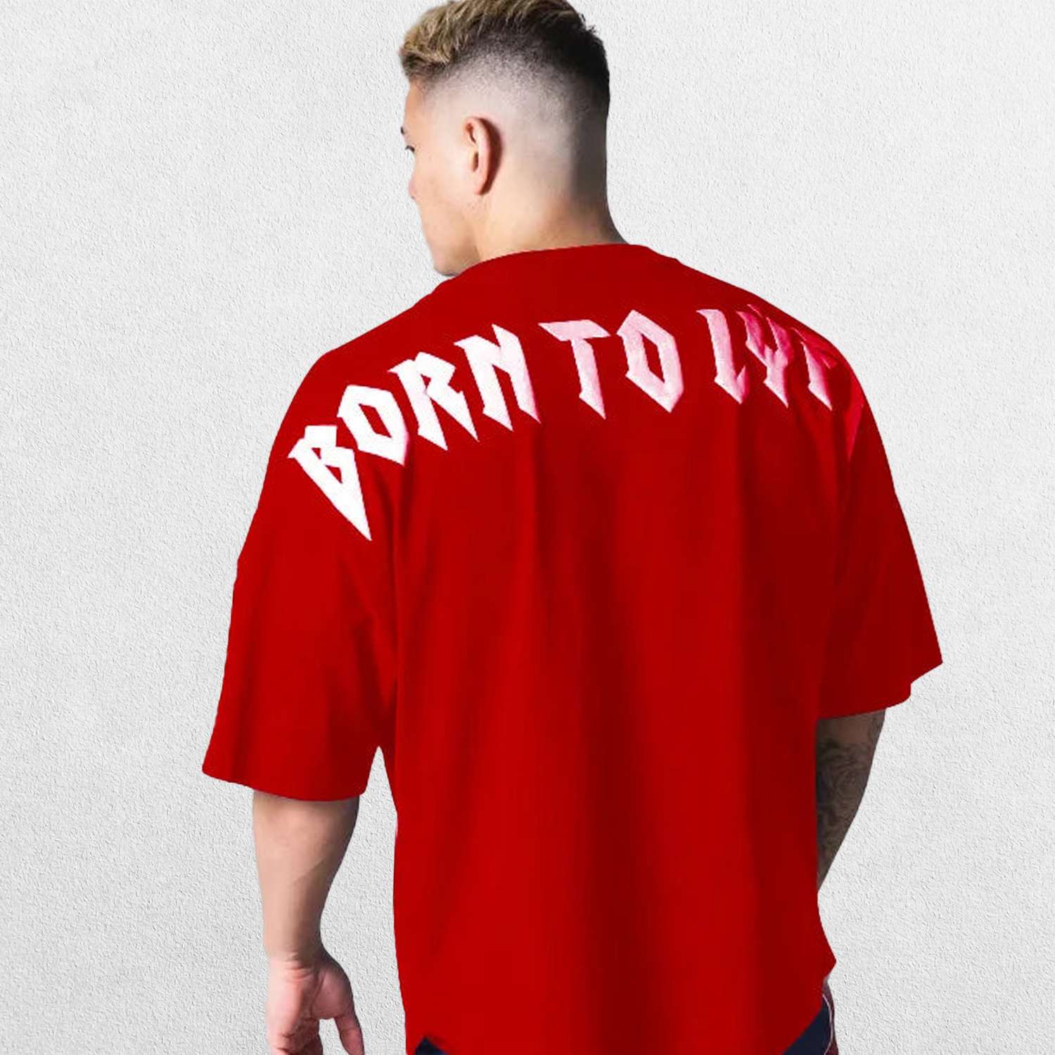 Model wearing Red GPW Oversized T-Shirt, styled for streetwear and gym.