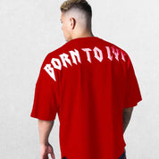 Model wearing Red GPW Oversized T-Shirt, styled for streetwear and gym.