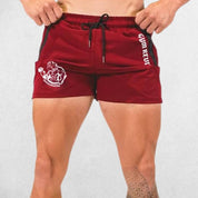 Model wearing Red GPW Men’s Quick-Dry Running Shorts - Gym, Bodybuilding, Beachwear