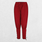 Front view of Red loose-fit Viking Navigator Pants with lace-up calf design.