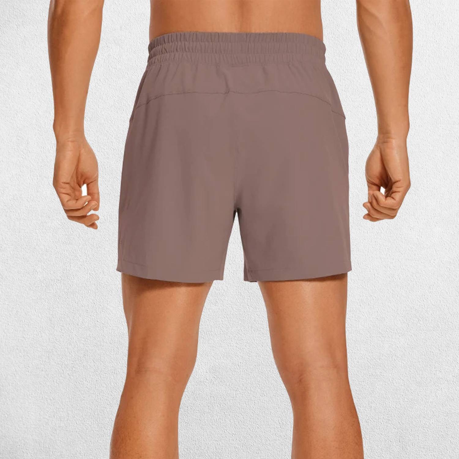 Back Close-up of Rosy Brown GPW Men's Lightweight Quick-Dry Workout Shorts with Pockets in a studio background