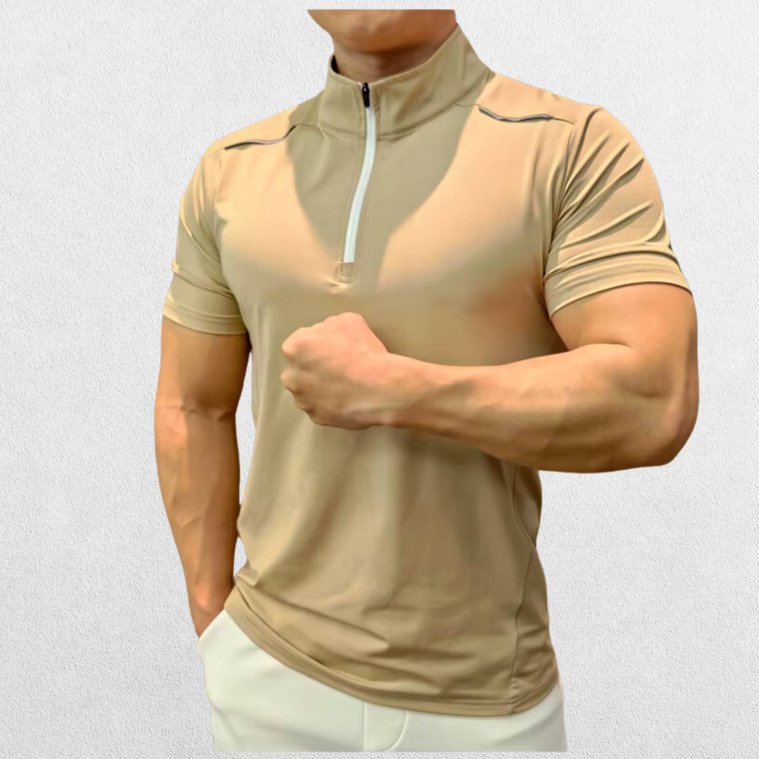 Side angle of the GPW Men's High-Performance Short Sleeve Training Shirt in khaki, showcasing the stylish cut and breathable performance fabric with a neutral studio