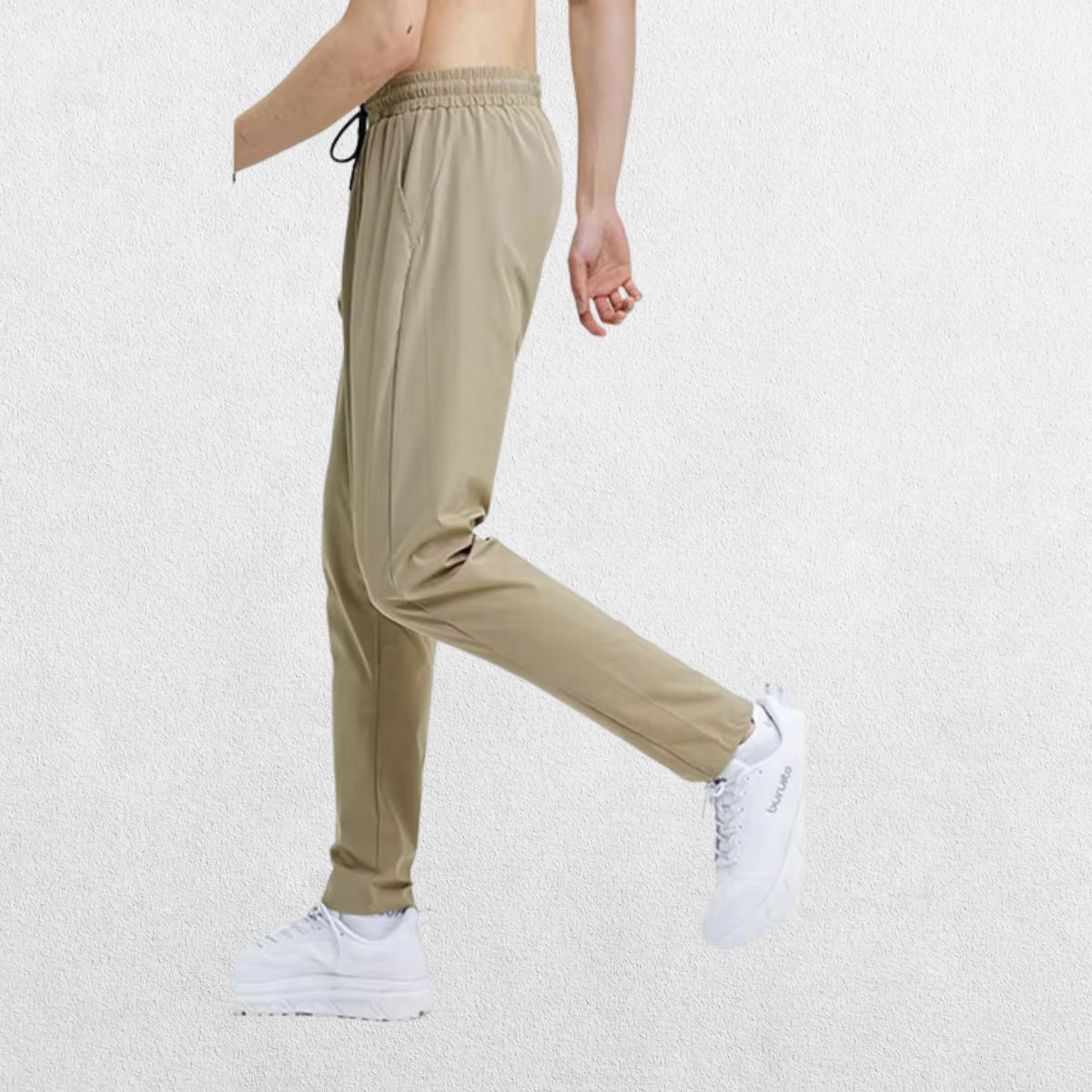 Side angle of the GPW Men's Slim Fit Pencil Pants in khaki, featuring the ankle-length design and comfortable fit in a clean studio environment.
