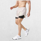 "Side profile of the GPW High-Performance Men’s Running Shorts in white, emphasizing the flexible movement and quick-dry material with a neutral studio backdrop."