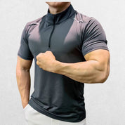 Side profile of the GPW Men's High-Performance Short Sleeve Training Shirt in grey, emphasizing the breathable fit and movement-friendly design with a neutral studio background.