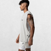 Side view of GPW Men's Performance Round Neck Sleeveless Shirt in white, highlighting the fit and design, with a neutral studio background.