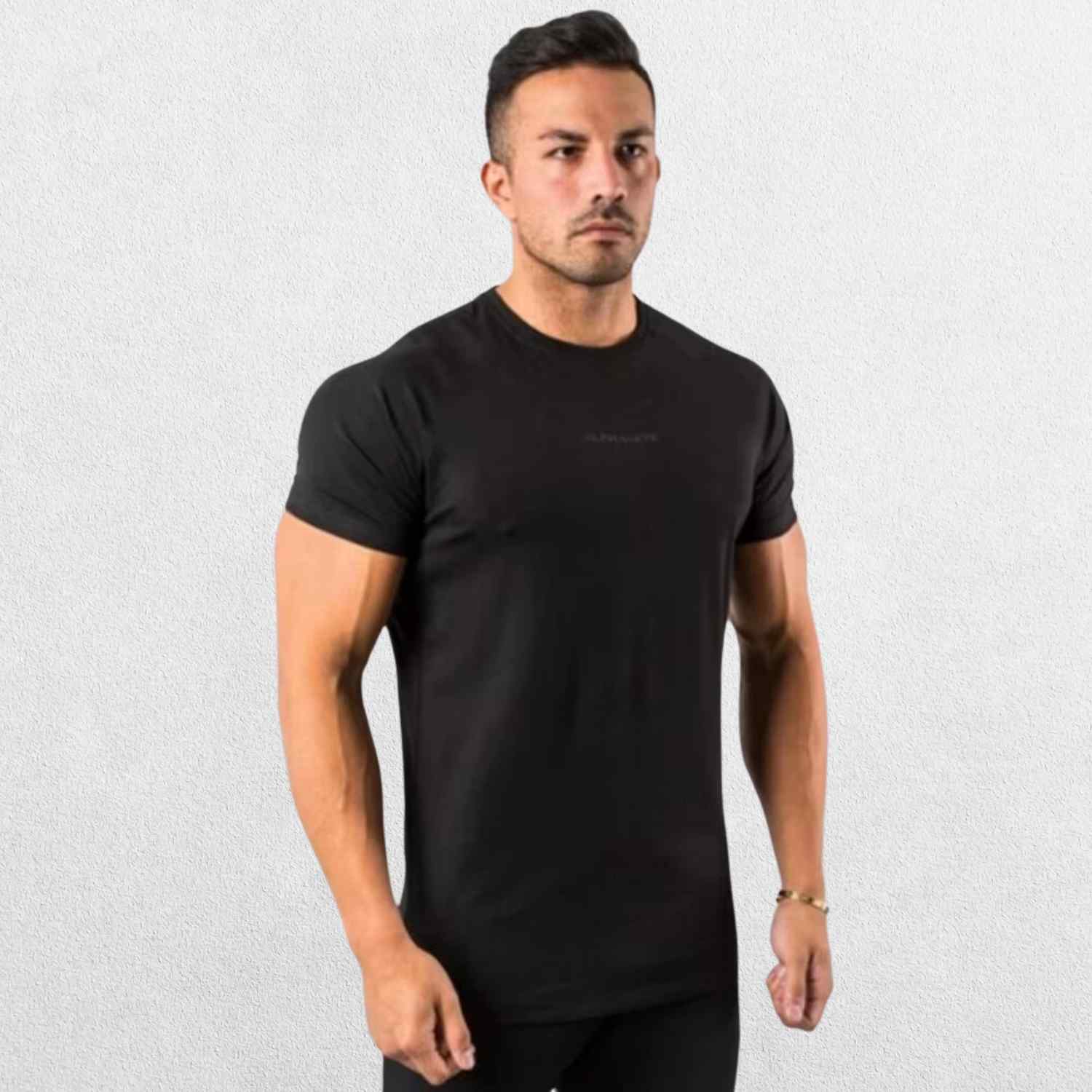 Side view of the GPW High-Performance Workout T-Shirt in black, emphasizing the stretchable material and ergonomic fit with a neutral studio backdrop.
