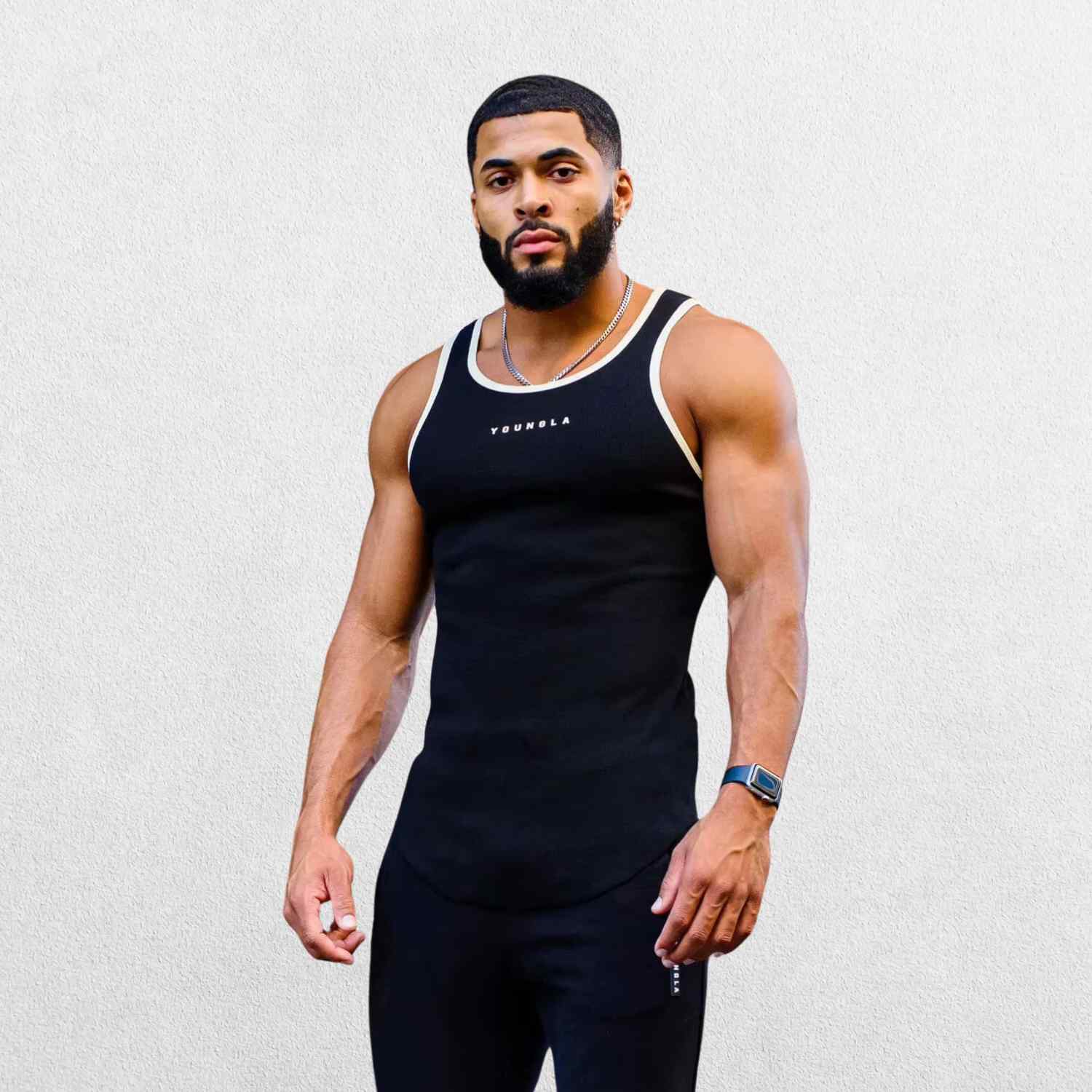 Side view of the GPW Men’s High-Performance Quick-Dry Training T-Shirt in black, showcasing the ergonomic cut and breathable material with a neutral studio backdrop.