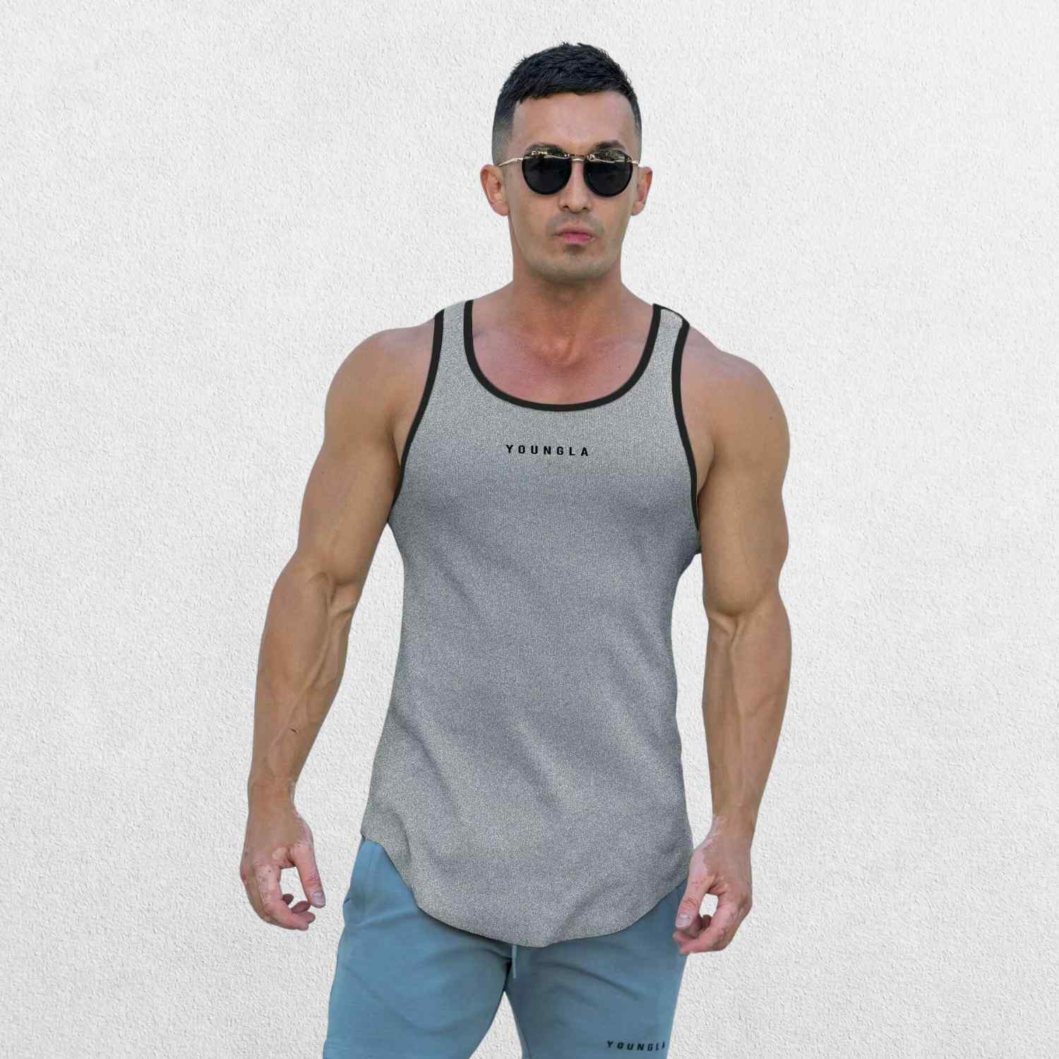 Side view of the GPW Men’s High-Performance Quick-Dry Training T-Shirt in grey, showcasing the modern cut and stretchable fabric with a neutral studio backdrop.