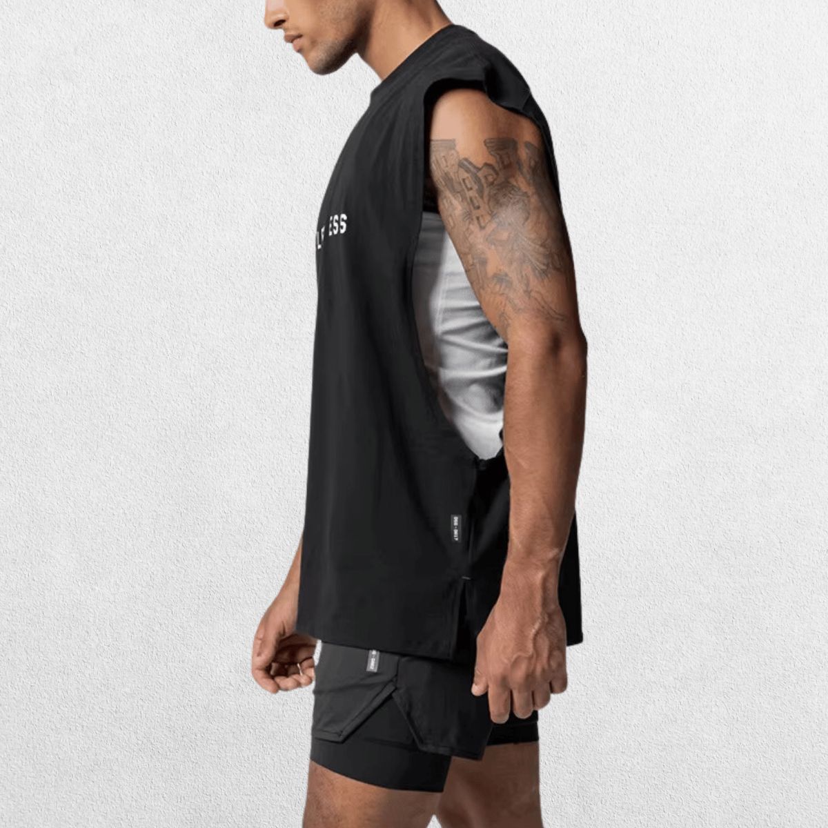 Side view of the GPW Men's Performance Round Neck Sleeveless Shirt in black, showing off the streamlined fit and detailing against a neutral studio backdrop.
