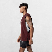 Side view of the GPW Men's Performance Round Neck Sleeveless Shirt in burgundy, illustrating the clean design and fit with a calm studio backdrop.