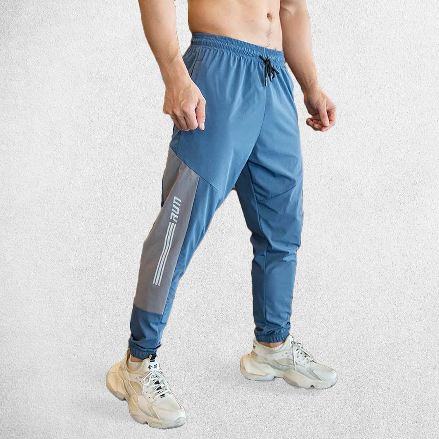 Men’s gym sweatpants with elastic waistband and zipper pockets for secure storage