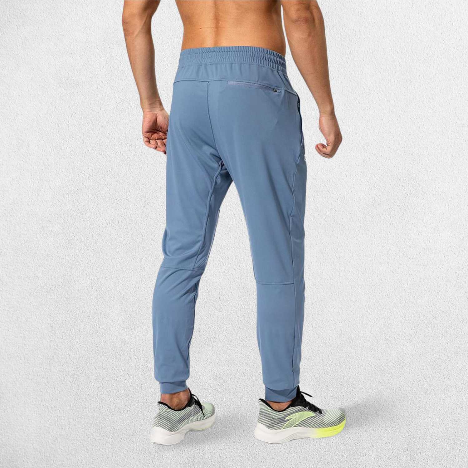 Rear view of State Blue GPW Men's Sweatpants showcasing their flexible and comfortable fit.