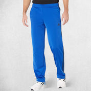 Model Wearing Team Royal Blue 3-Stripes Tracksuit Pants made with Primegreen fabric
