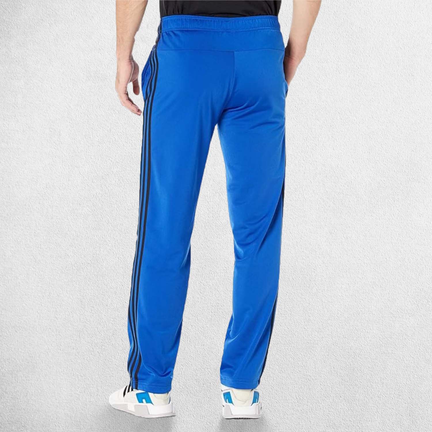 Back View of Model Wearing Team Royal Blue 3-Stripes Tracksuit Pants made with Primegreen fabric