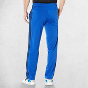 Back View of Model Wearing Team Royal Blue 3-Stripes Tracksuit Pants made with Primegreen fabric