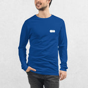 Model wearing the True ROyal GPW Long Sleeve Tee paired with jeans in a Studio Background.