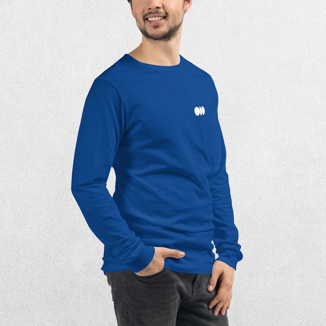 Model wearing the True ROyal GPW Long Sleeve Tee paired with jeans in a Studio Background.